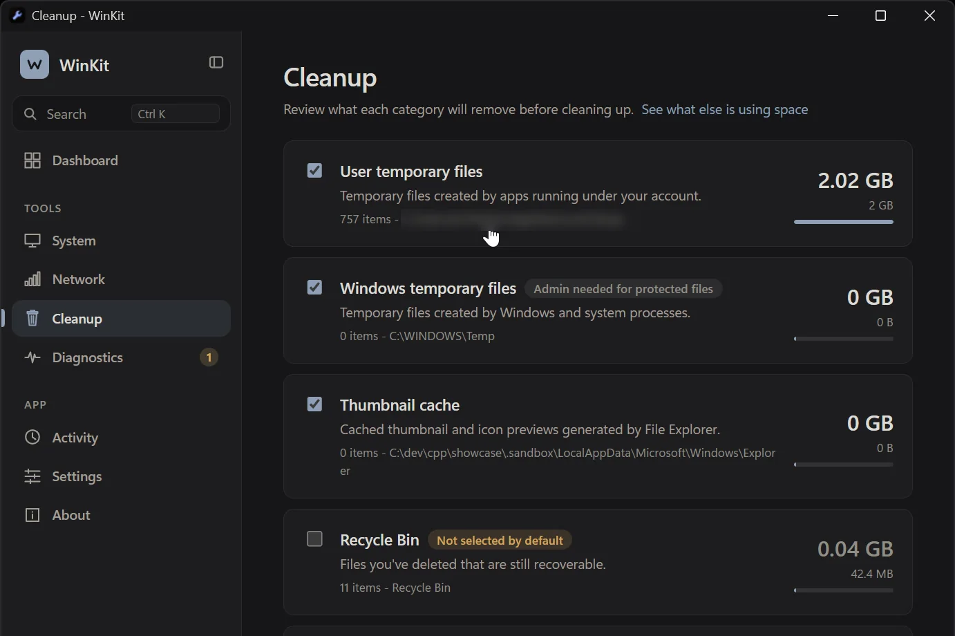 WinKit Cleanup with user temporary files, Windows temporary files, the thumbnail cache, the Recycle Bin (not selected by default) and the Windows Update cache, 2.08 GB selected.